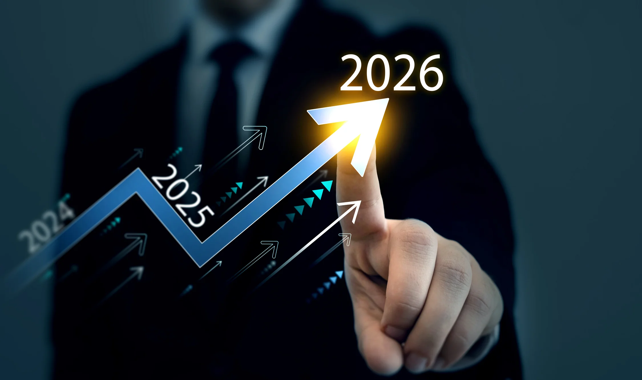 Business professional pointing at a glowing upward-trending growth arrow chart spanning 2024 to 2026, symbolizing federal procurement growth trends and government contracting opportunities